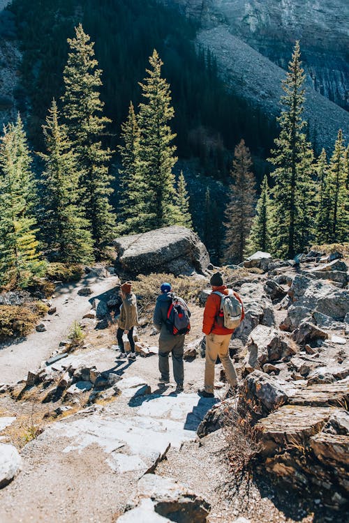 People Hiking in Rocky Mountains