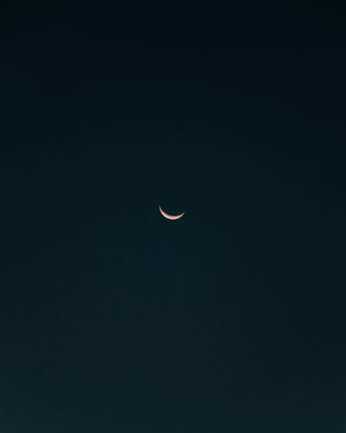 A Crescent Moon in the Dark Night Sky