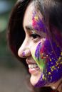 A Woman's Face Covered in Gulal