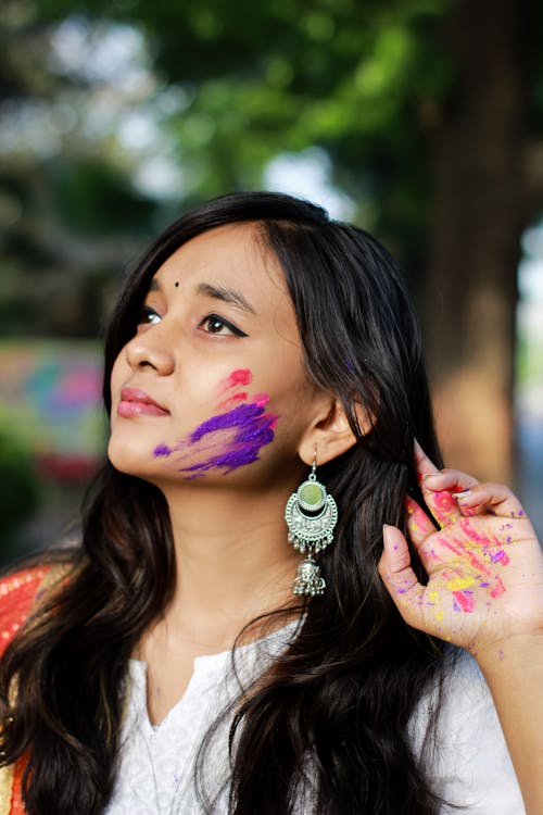 Woman with Multi Colored Painting on Face