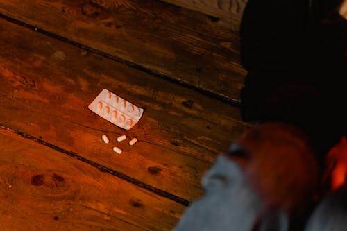 Free Medicine Tablets on the Wooden Floor Stock Photo