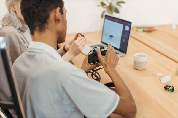 Editing photographs at a shared desk — Anastasia Shuraeva on Pexels