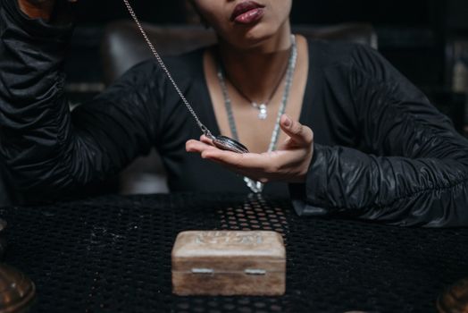 A Woman Holding a Silver Pocket Watch