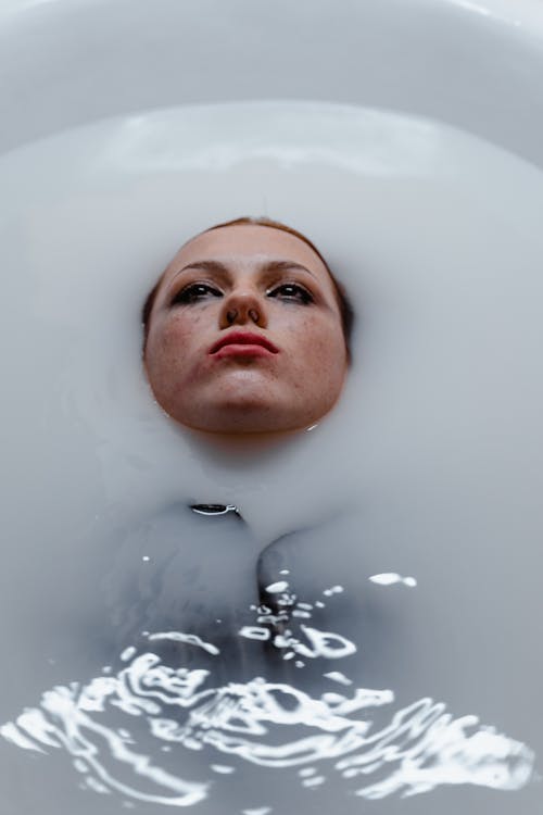 Woman Lying on a Bathtub