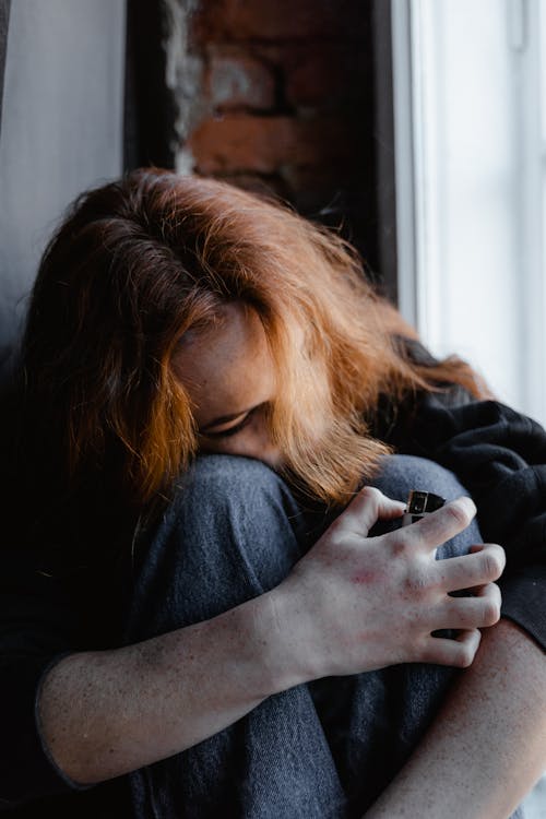 Lonely Woman Curled Up