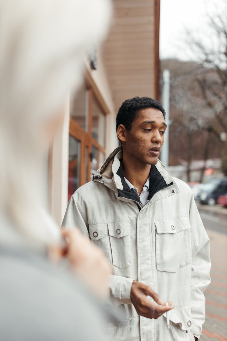 Man Smoking A Cigarette Outside