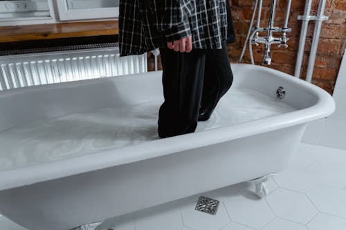 Person Standing in a Bathtub
