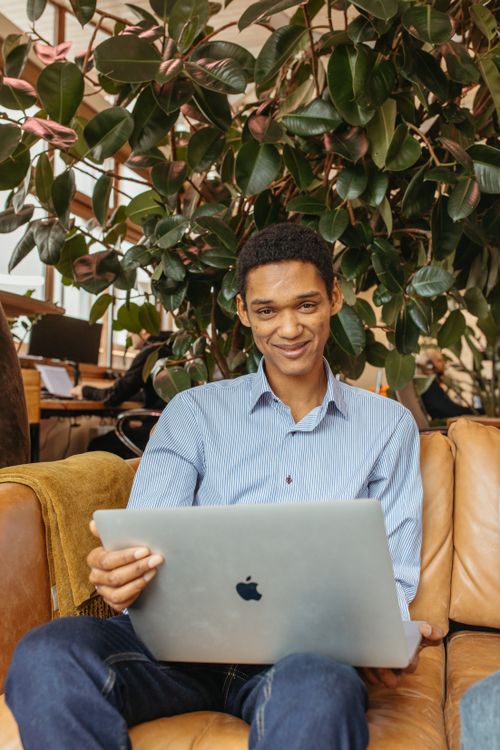Man Holding Silver MacBook Pro · Free Stock Photo