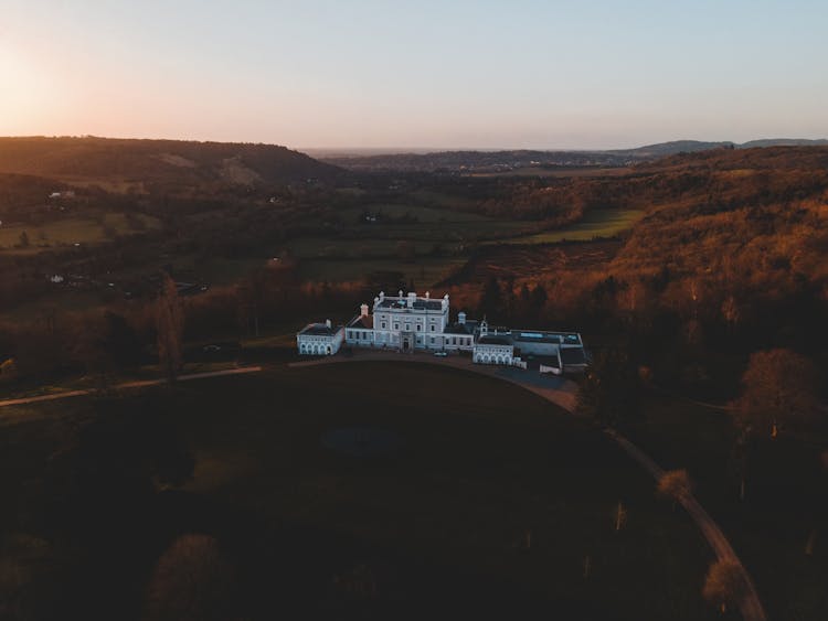 Dark Aerial Image Of A Palace In A Park