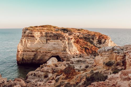 Free Explore the breathtaking cliffs and ocean views of the Algarve coastline in Faro, Portugal. Stock Photo