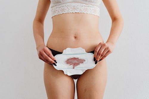 Free A Woman Holding a Menstrual Pad Stock Photo