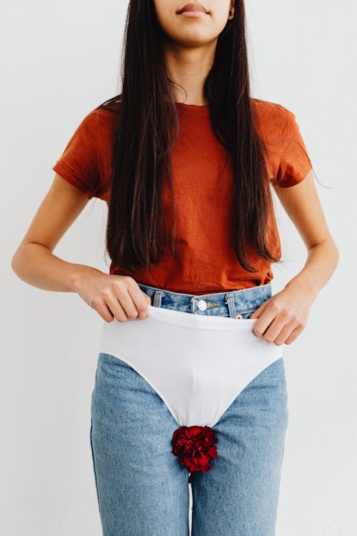 Free Flower and Underwear on Jeans Stock Photo