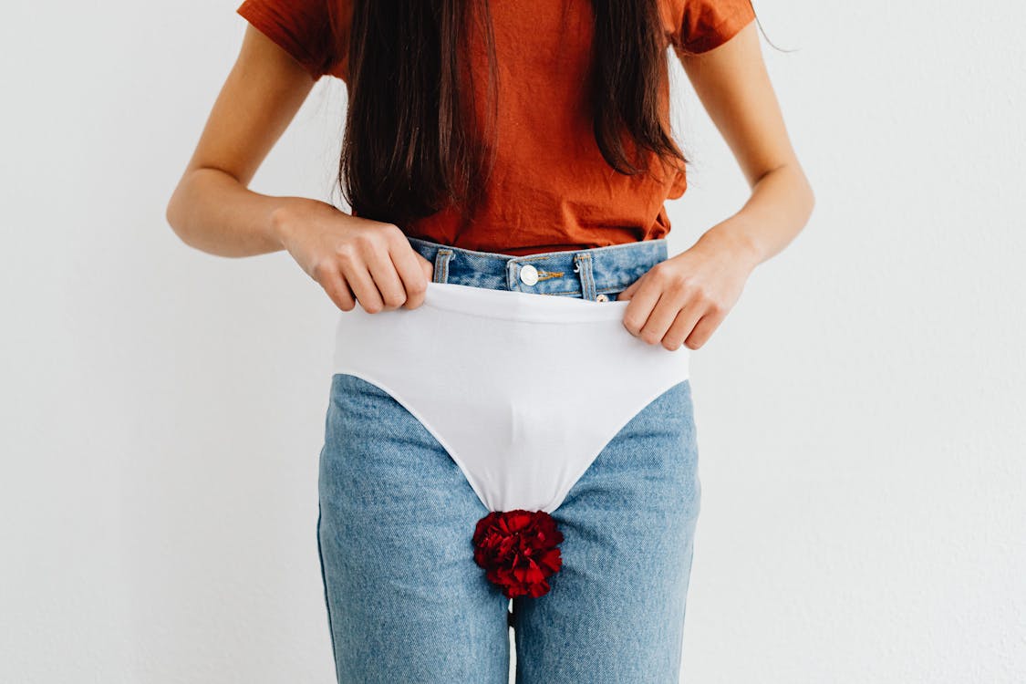 Close up of a Woman Wearing Underwear Over Jeans · Free Stock Photo
