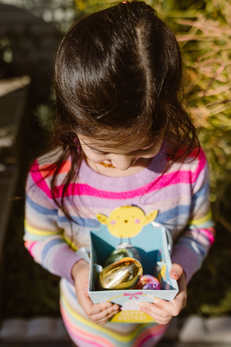 Girl Holding A Box With Easter Eggs