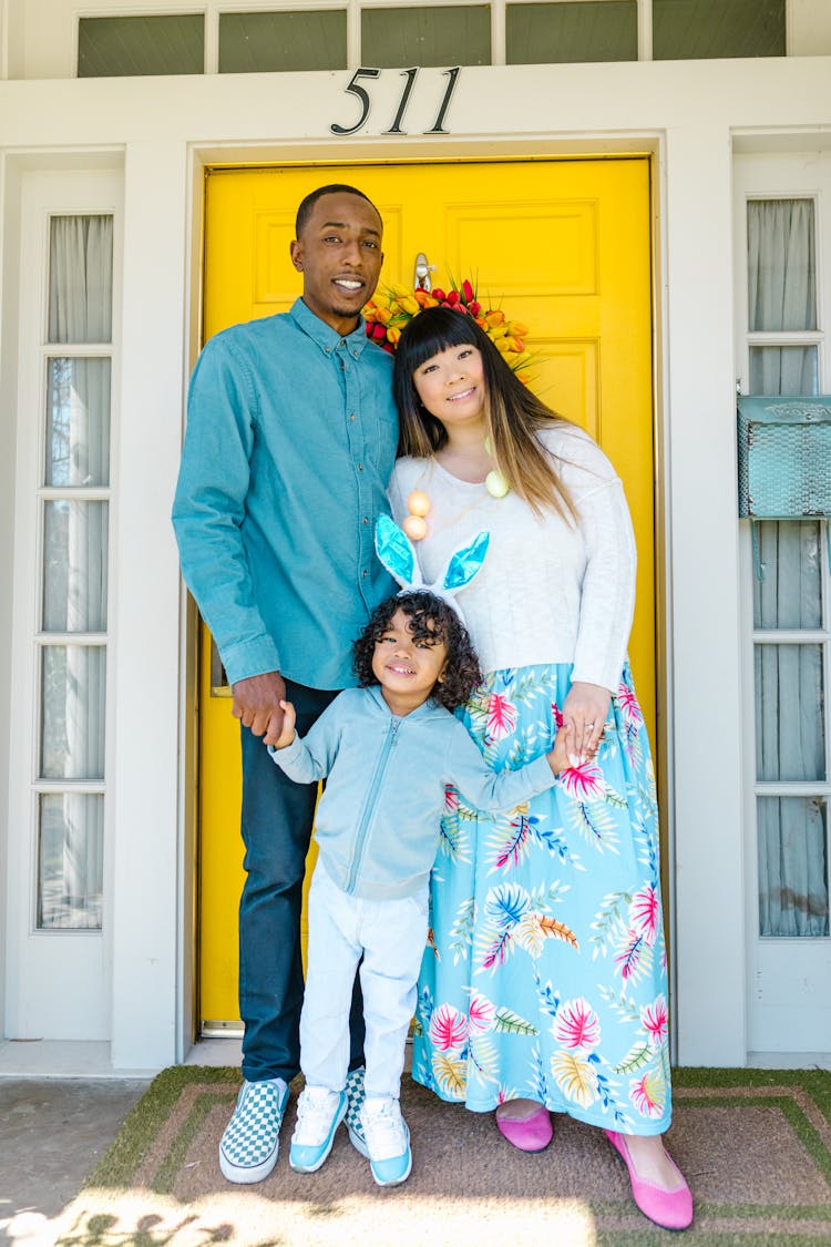 A Family Standing In The Doorway