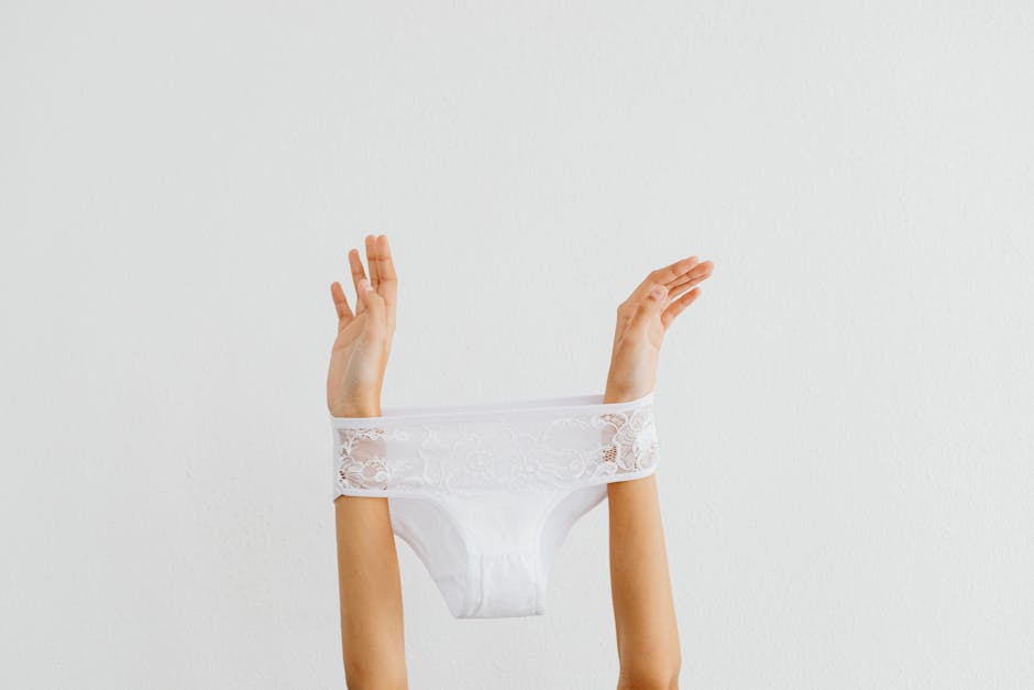 A Person Holding White Panty · Free Stock Photo