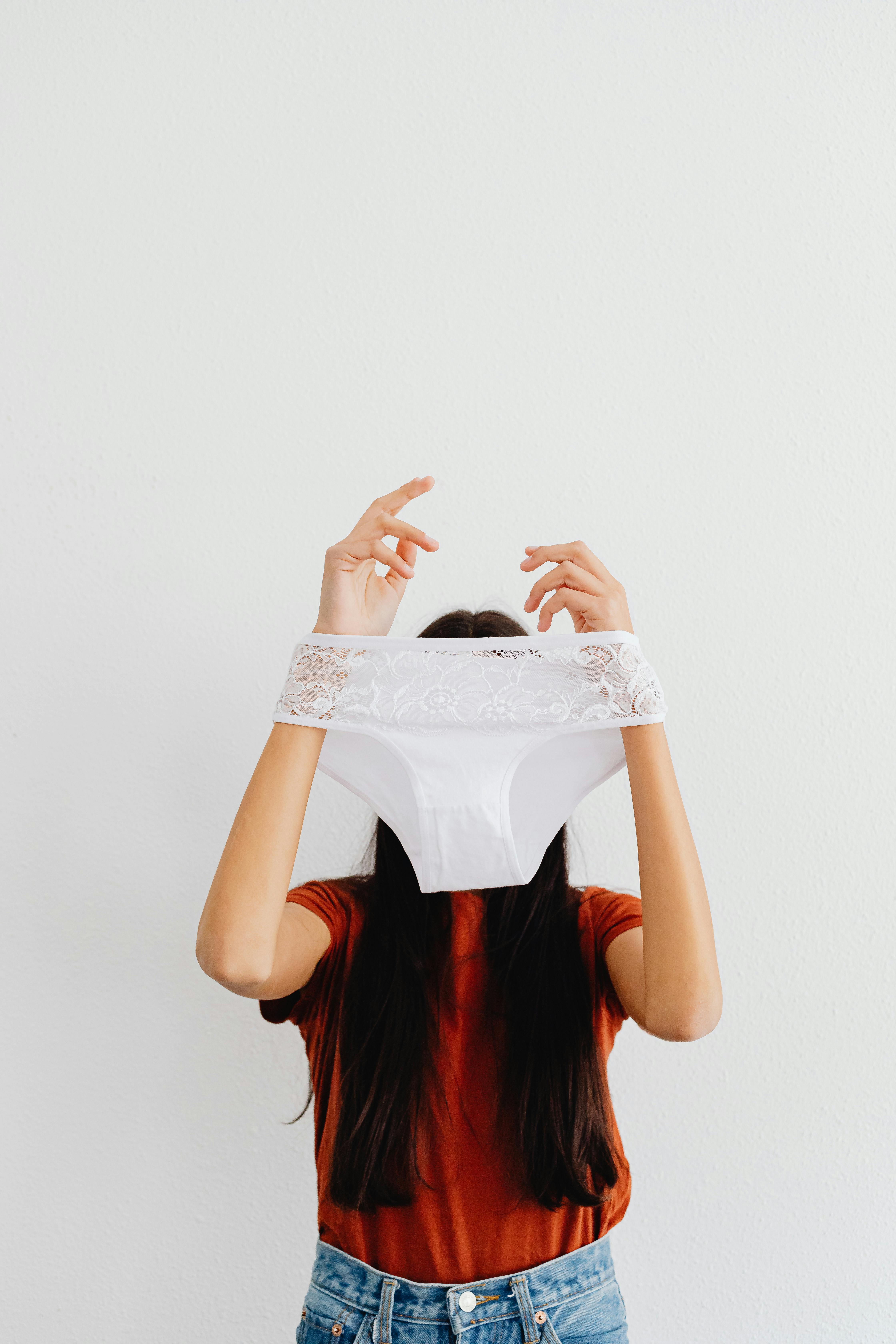 A Woman Holding White Panty