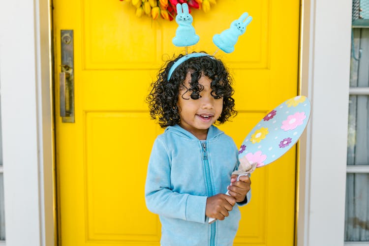 Little Girl Wearing A Bunny Headband