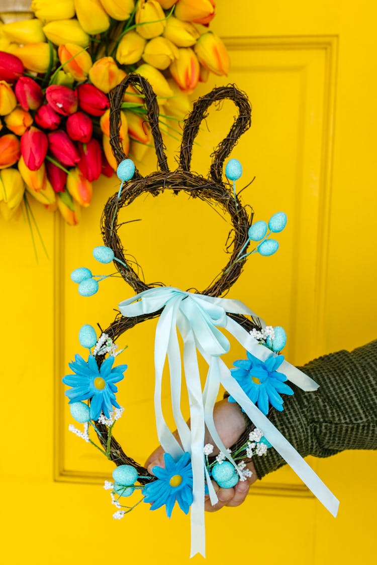 A Person Holding Easter Decorations