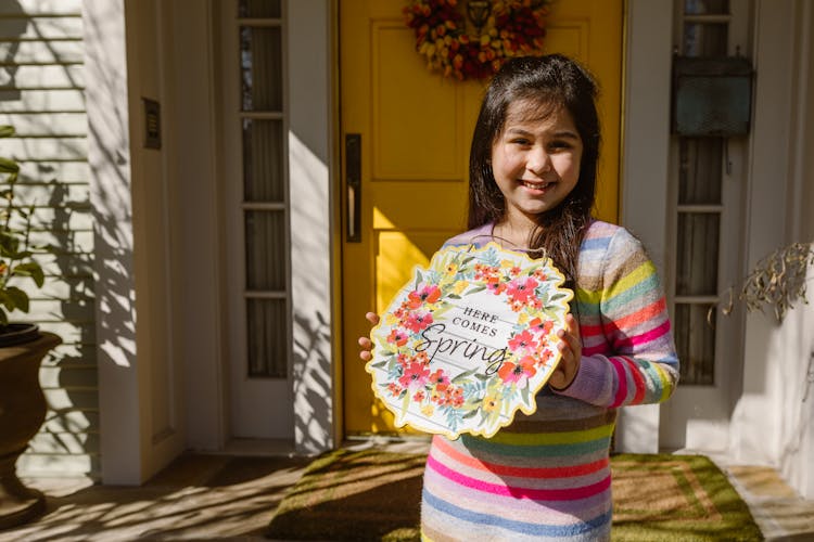 Cute Girl Holding An Easter Decor