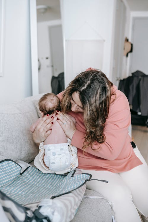 Free Woman Holding her Baby Stock Photo