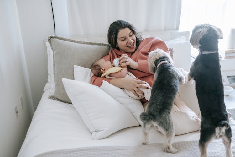 Woman Feeding A Baby