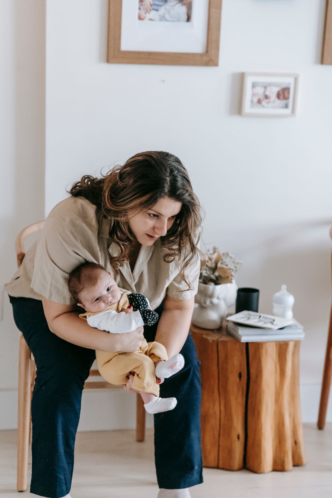 Mother holding her baby in a calm home environment