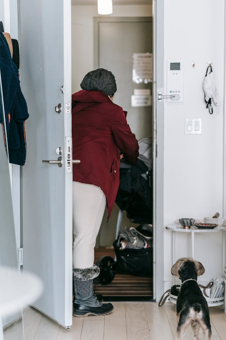 Woman Entering Home With Stroller