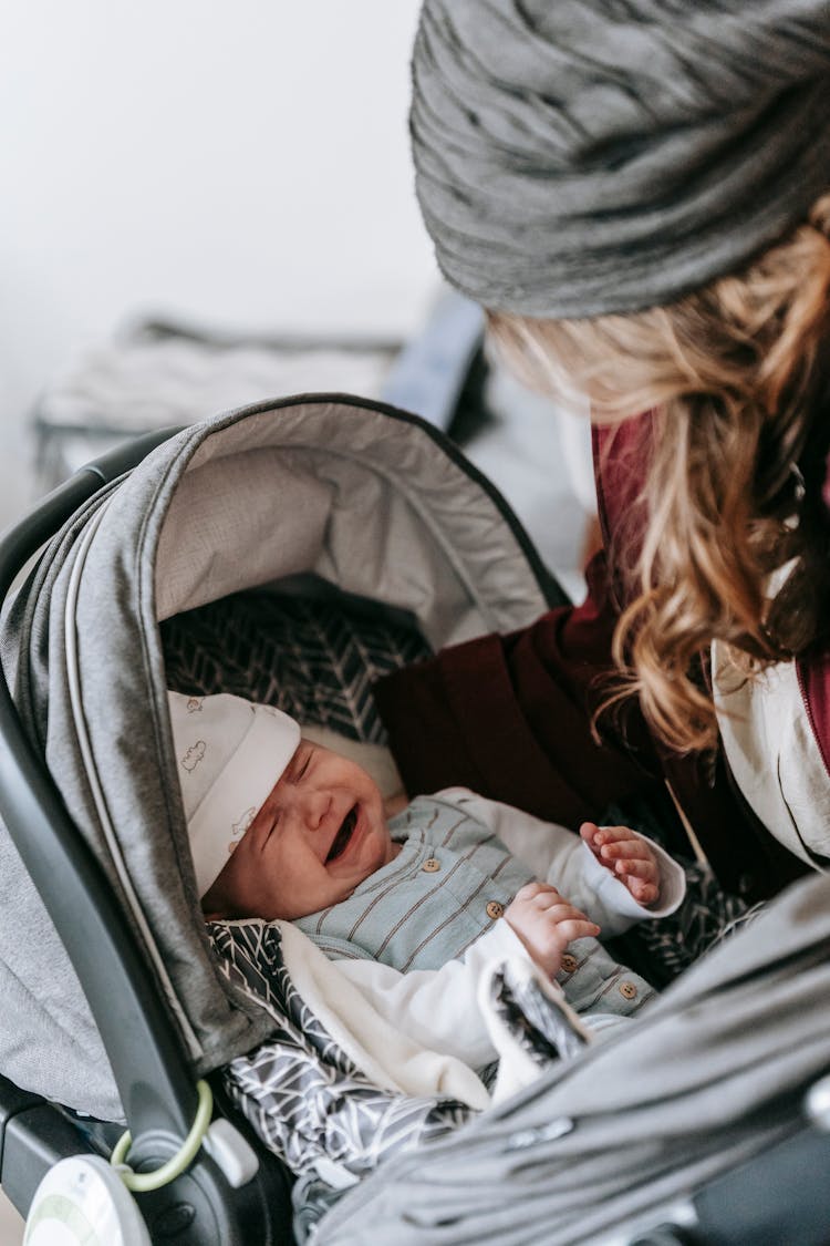 Crop Mother With Newborn In Stroller