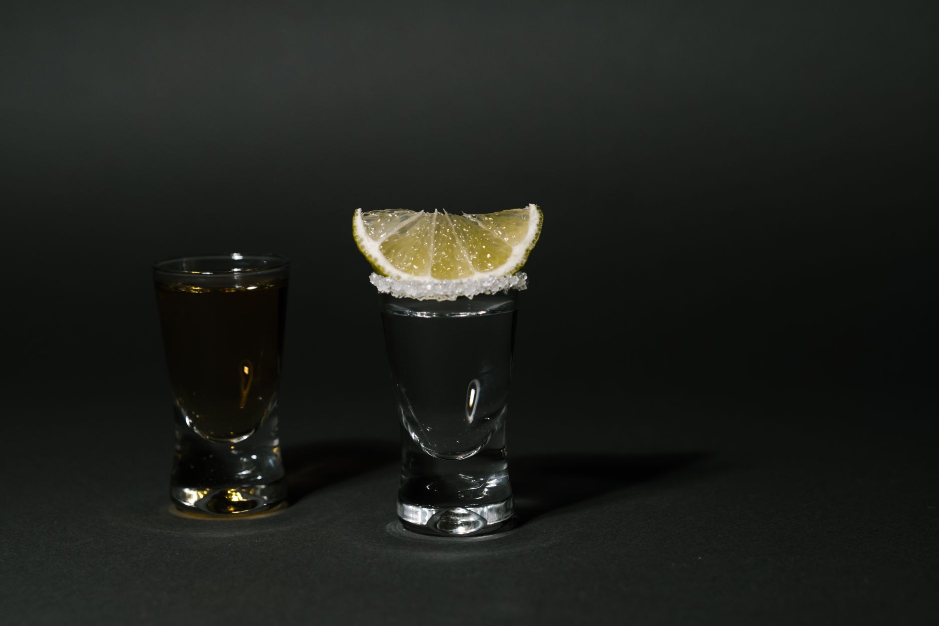 Serving Anejo tequila neat with traditional glassware