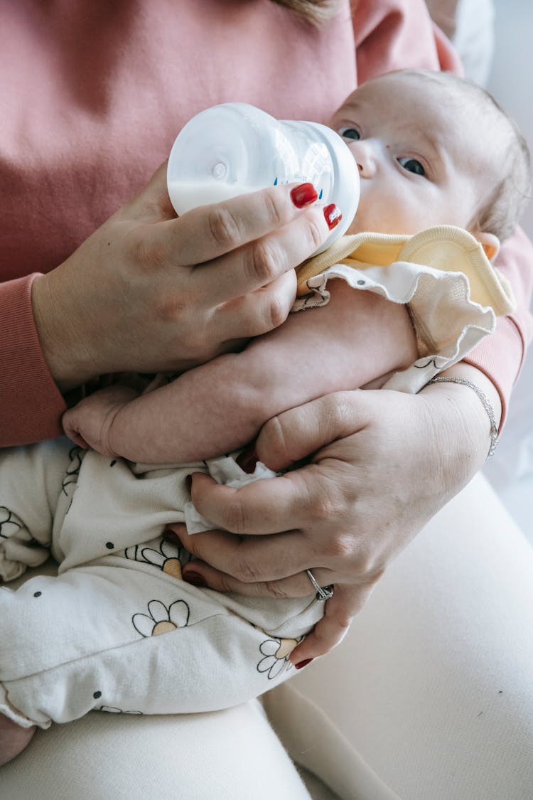 Anonymous Mother Feeding Newborn Baby