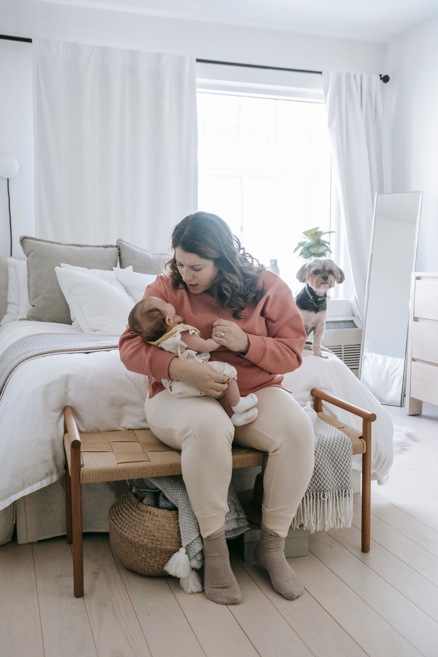 Mother and baby together in a softly lit nursery setting
