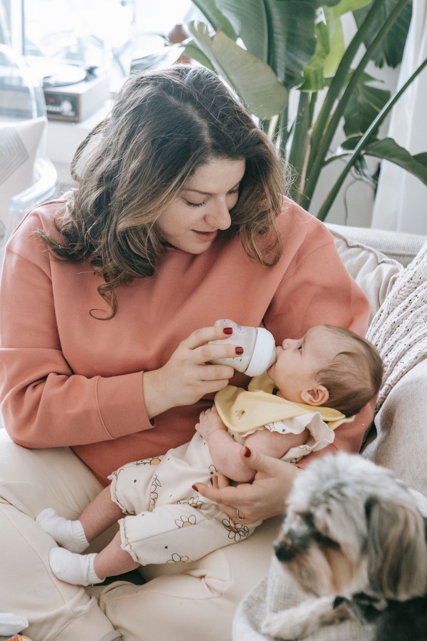 Mother caring for her baby during an everyday feeding routine