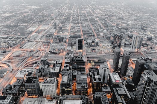 Stunning aerial cityscape of Chicago showcasing its urban structure and illuminated streets at dusk.