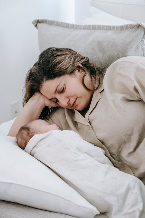 Free Mother Looking at Her Baby Stock Photo