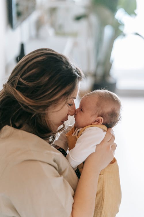 Free Mother and Baby Touching Nose Stock Photo