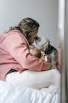 Free Woman Kissing Her Dog Stock Photo