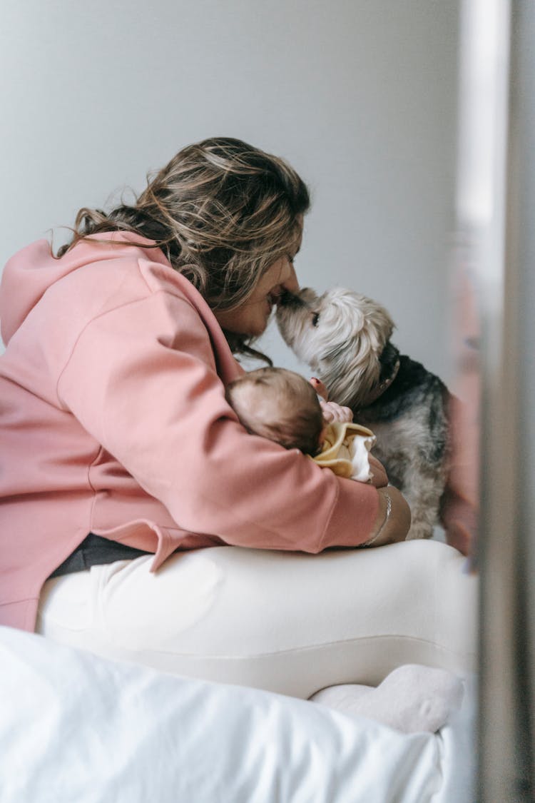 Woman Kissing Her Dog