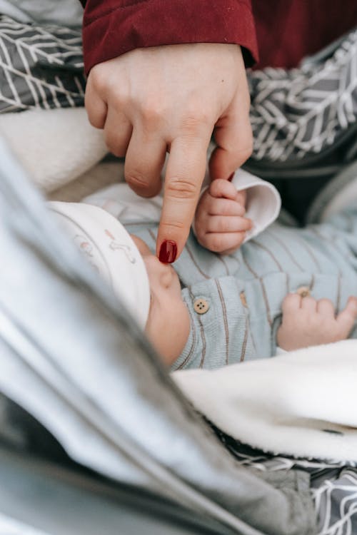 Person Touching a Baby's Nose 