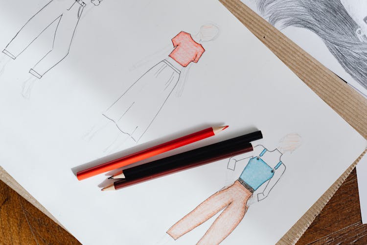 Fashion Sketches On White Paper