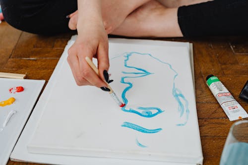 Close-Up Shot of a Person Painting