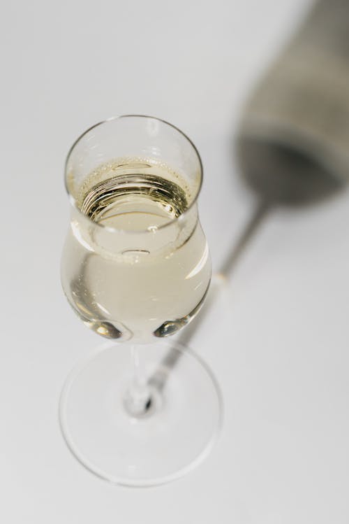 Close-Up Shot of a Glass of White Wine