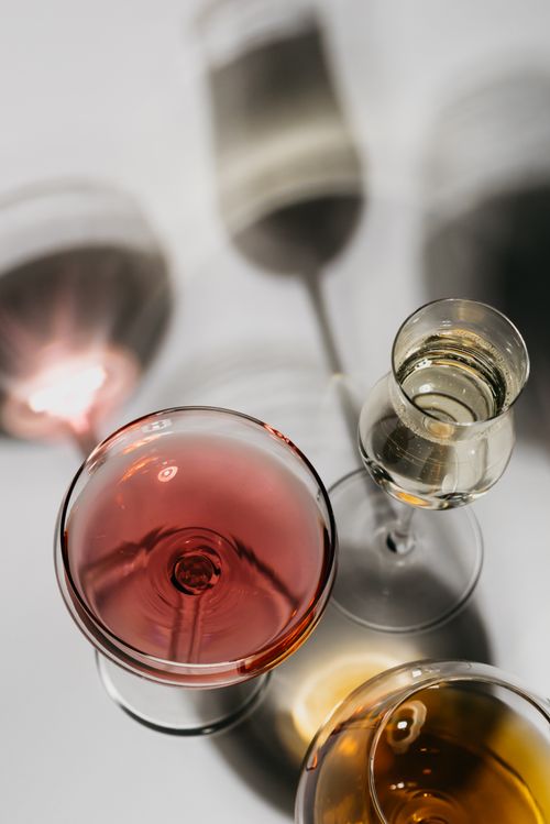 Free A high-angle view of various wine and spirit glasses casting artistic shadows. Stock Photo