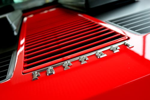 Free Close-up Photography of Red Metal Grille Stock Photo