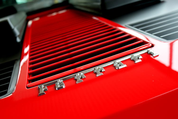 Close-up Photography Of Red Metal Grille