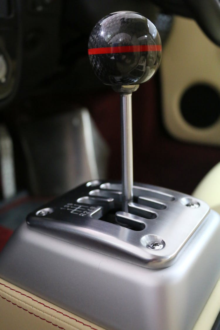 Selective Focus Photo Of Gray Gear Shift Lever