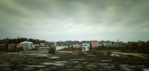 Assorted Color Concrete Building Under Cloudy Sky