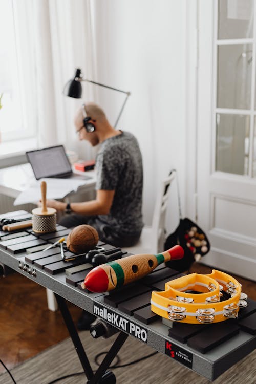 A Musician and an Assortment of Percussion Instruments