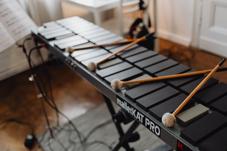 Drum Sticks On Top Of An Electronic Mallet