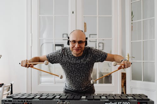 Smiling Man Playing Keyboard